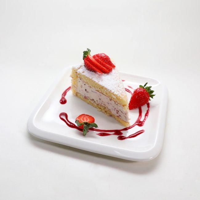 A closeup shot of a delicious strawberry cake in a plate